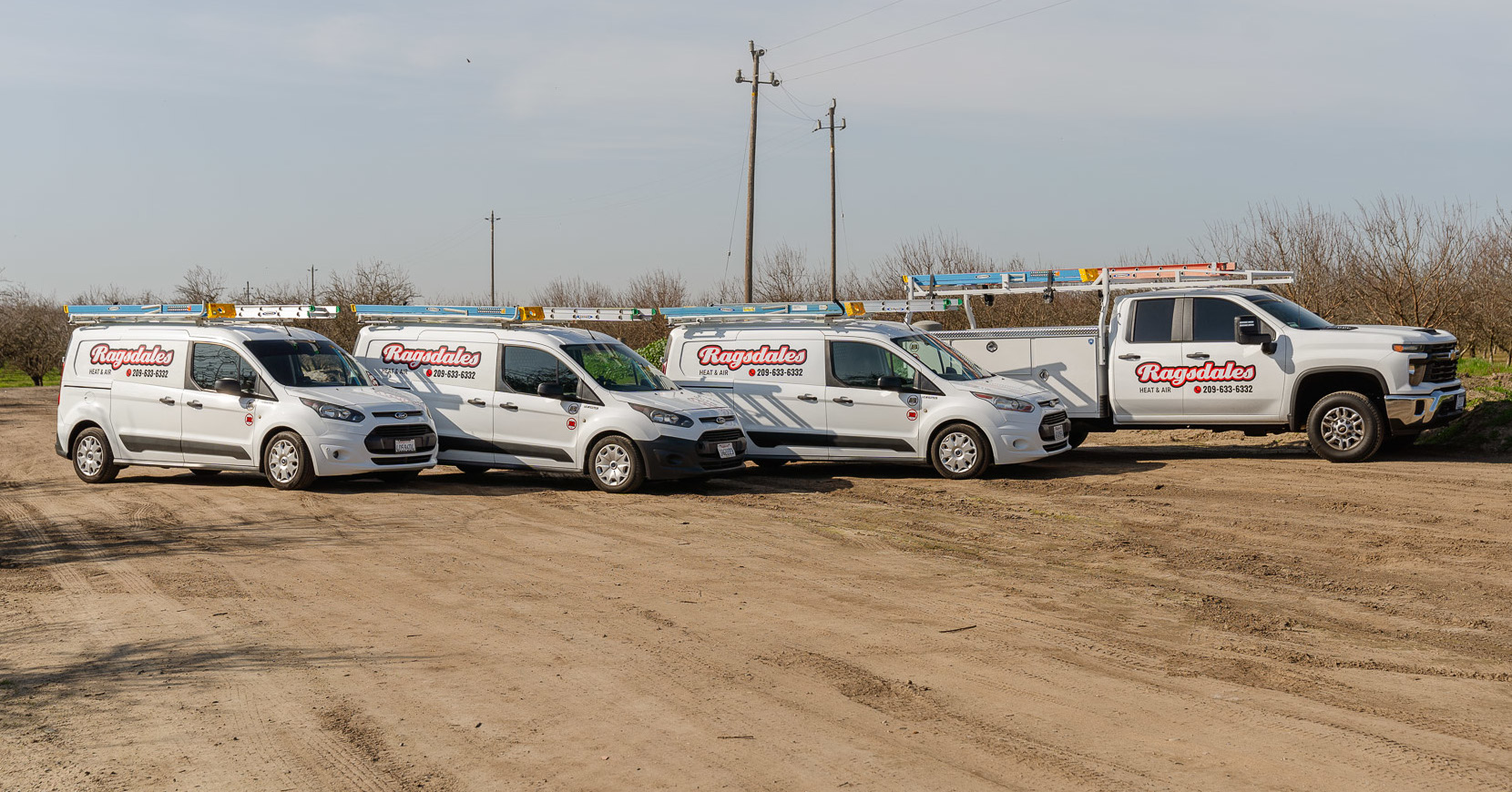 Ragsdales technician smiling in front of house