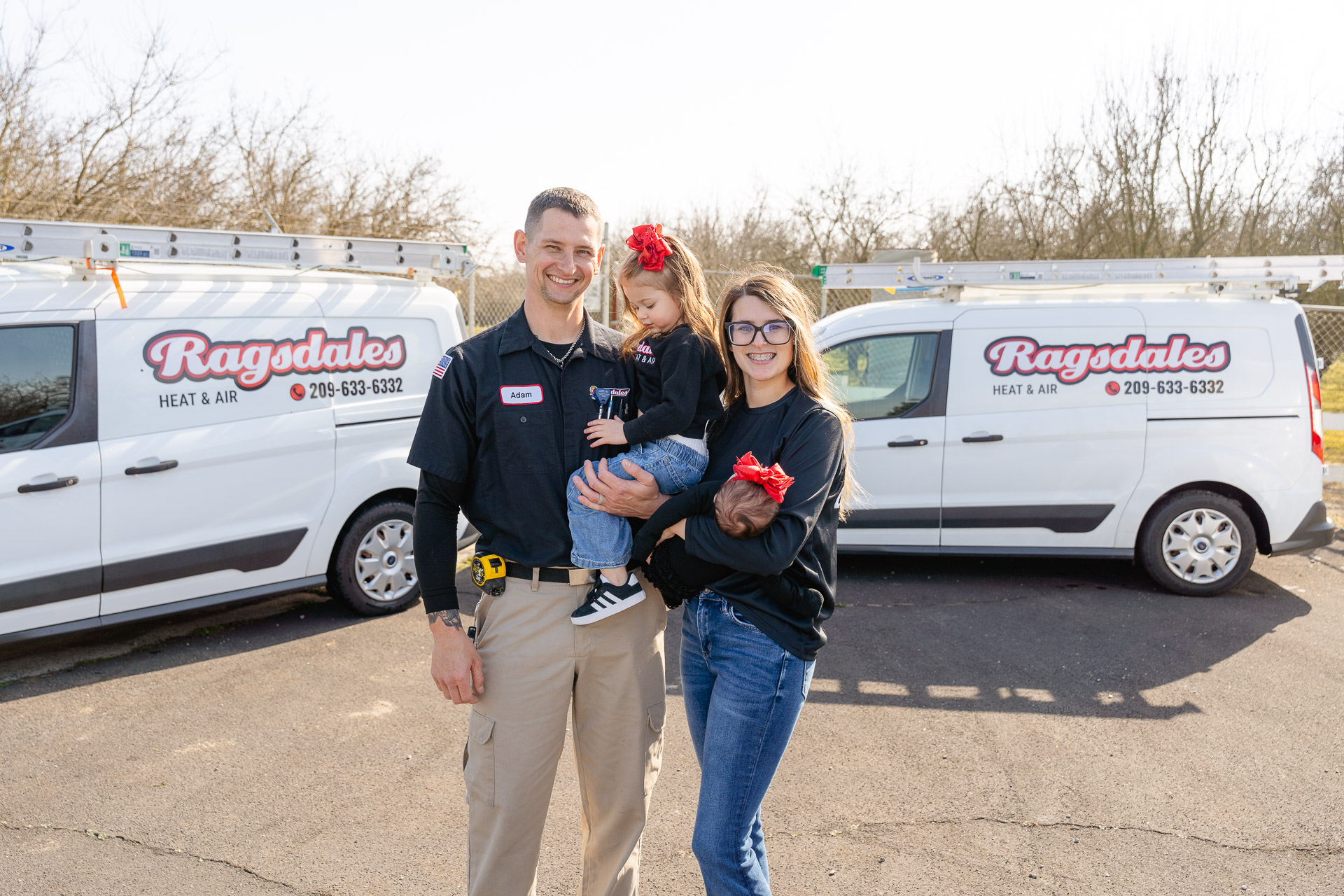 HVAC tech talking with homeowner in kitchen